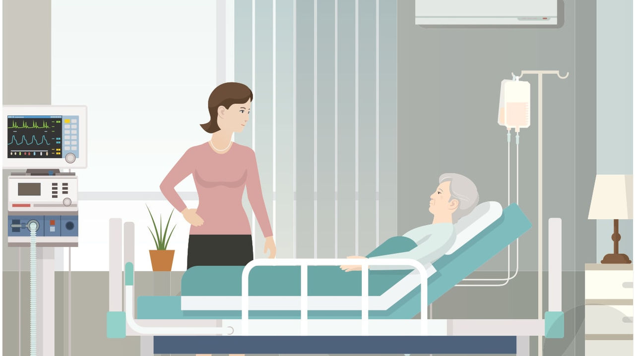 A woman is in a hospital room with a patient.