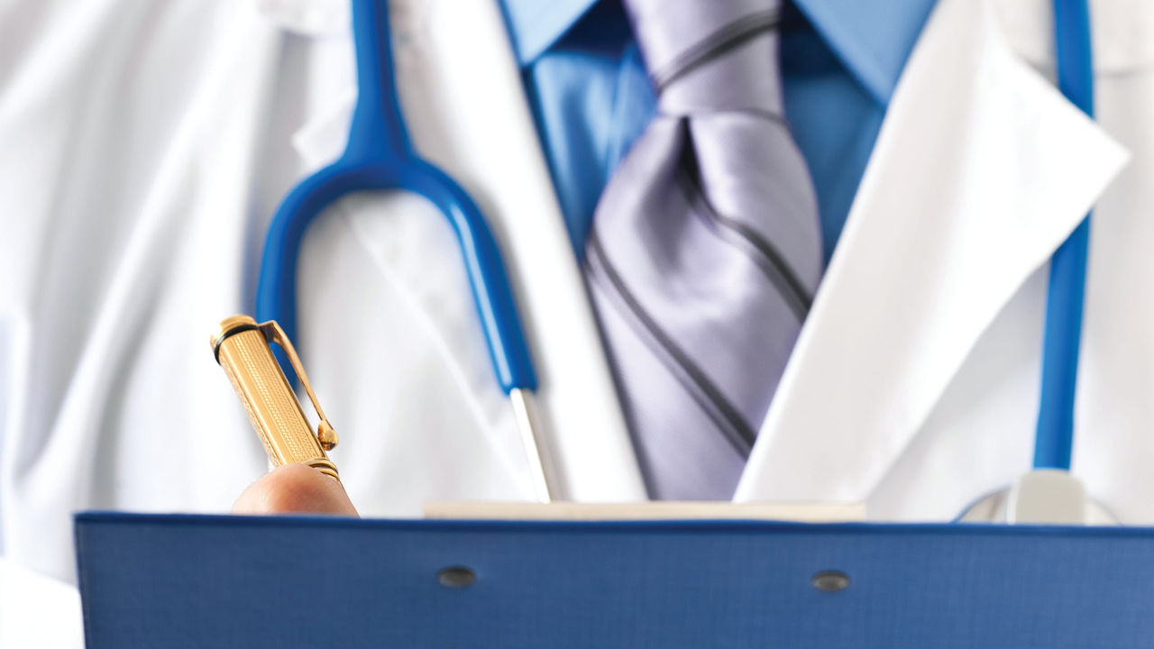 A doctor holding a clipboard with a stethoscope.