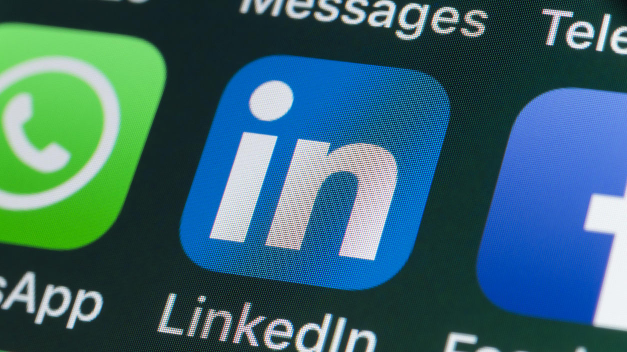 Social media icons on a phone screen.