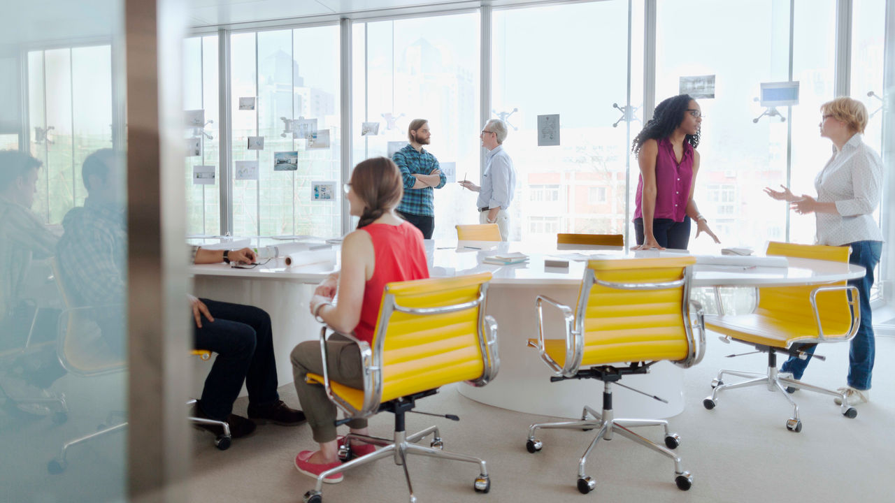 A group of people in a conference room.