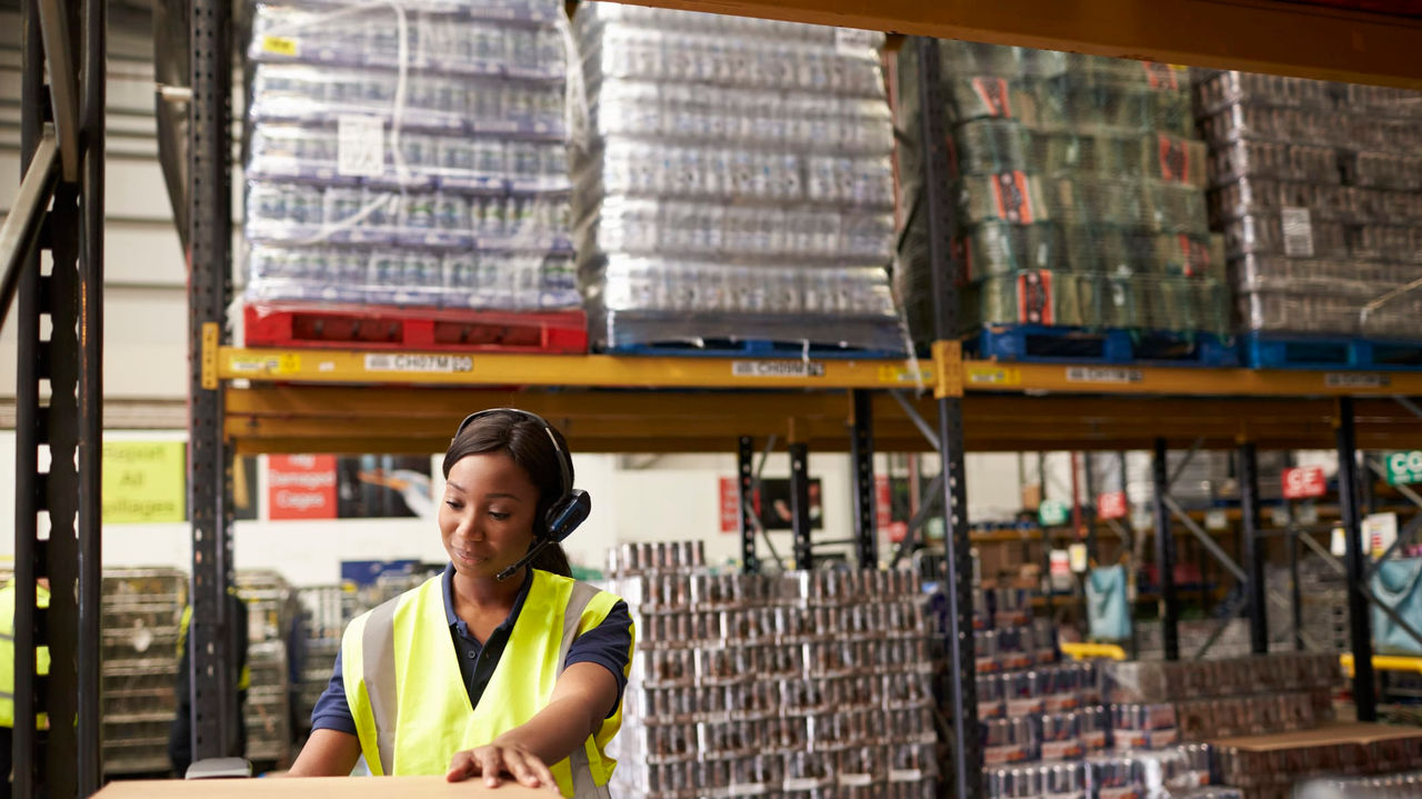 A woman working in a warehouse.