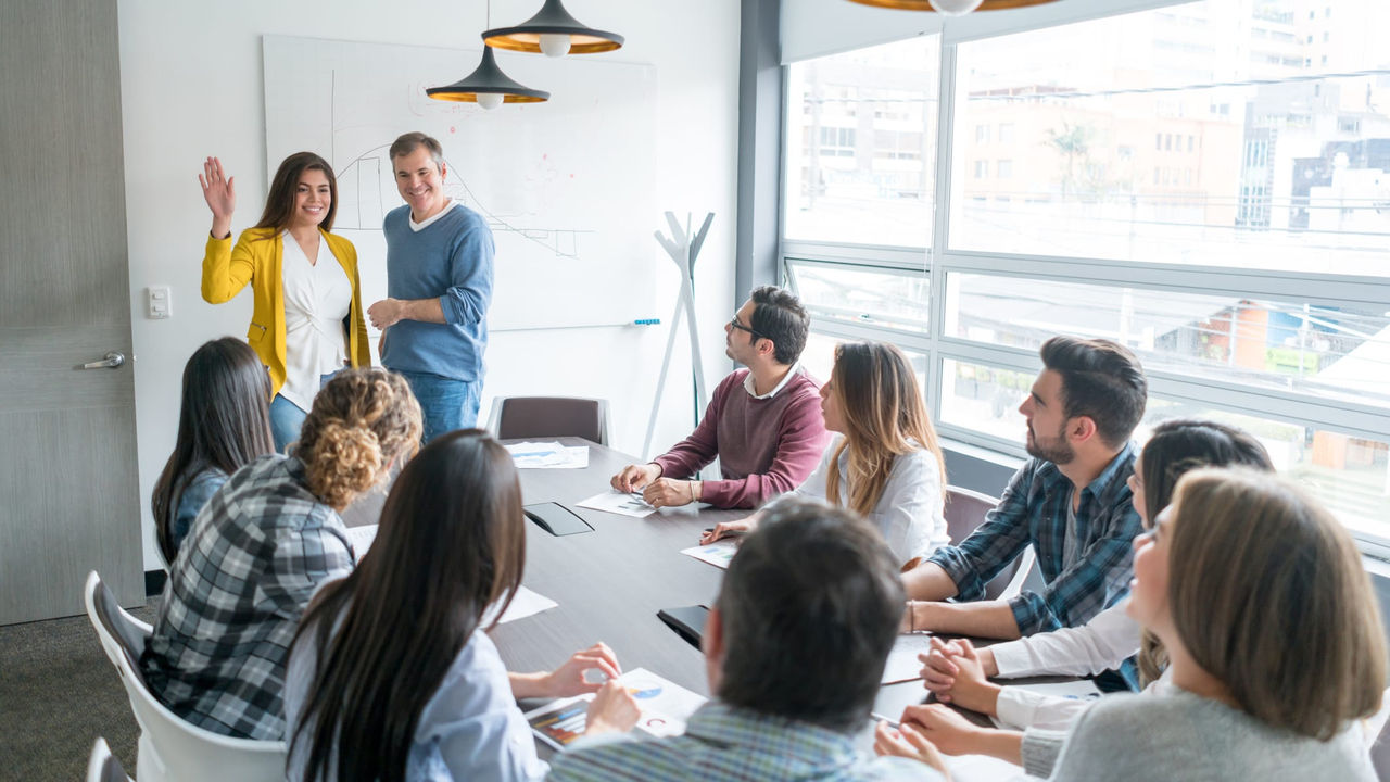 A group of people in a meeting room.