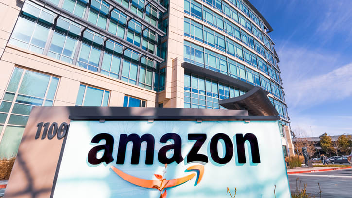 A sign for amazon in front of a building.