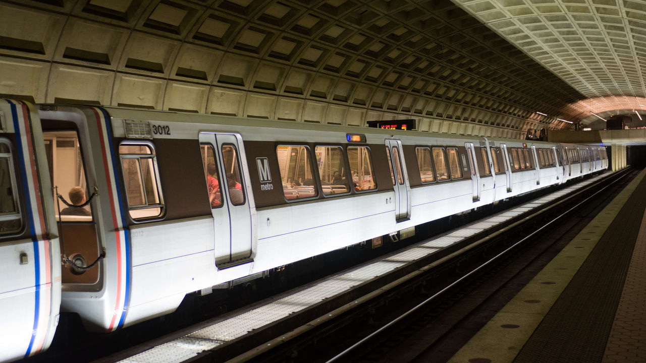 A subway train on the tracks.