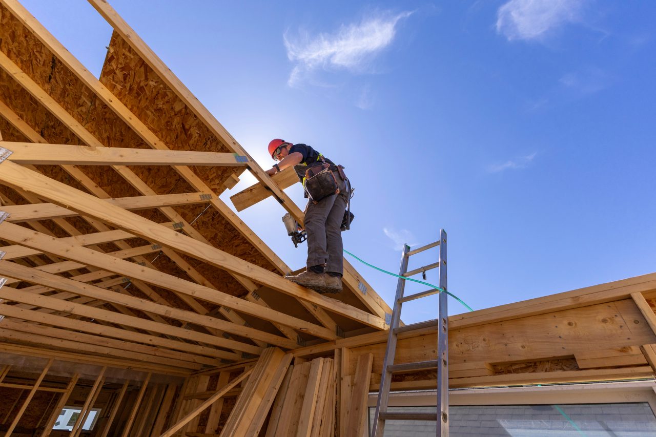 Construction worker on top of a roof