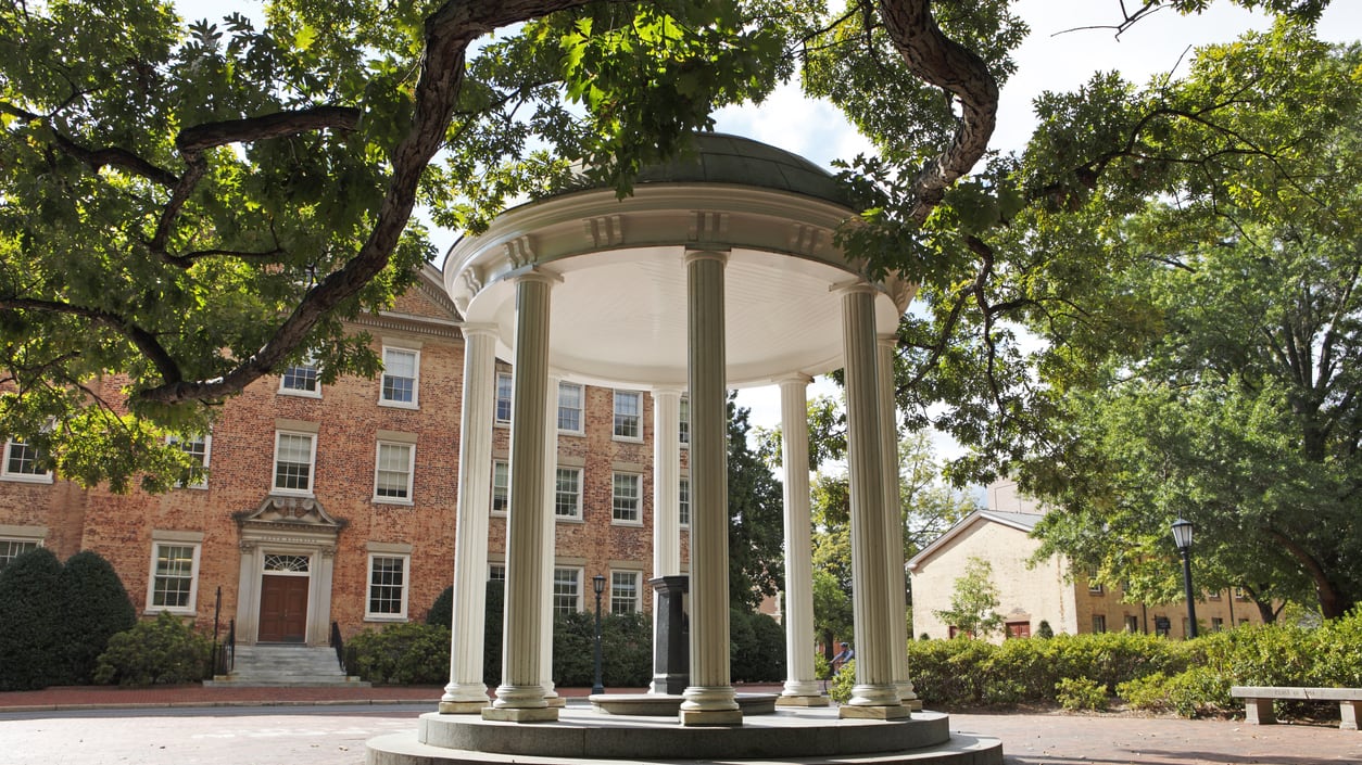 A gazebo sits in the middle of a courtyard.