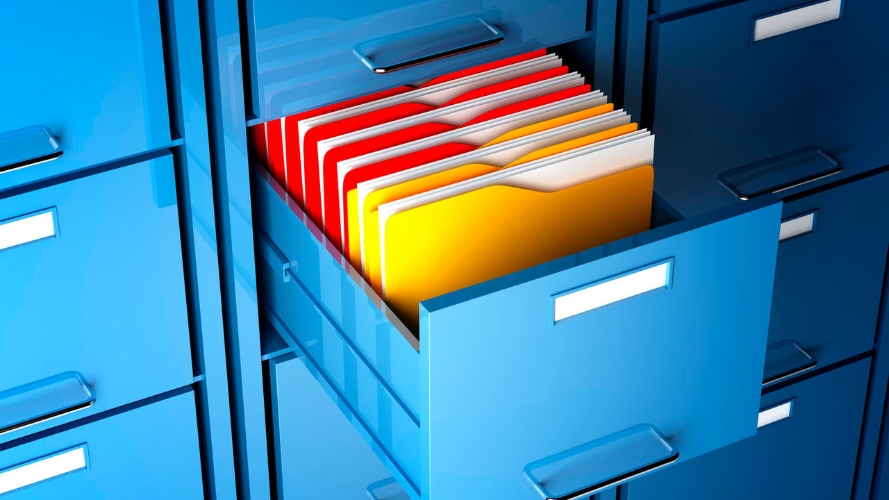 A blue filing cabinet with yellow folders in it.