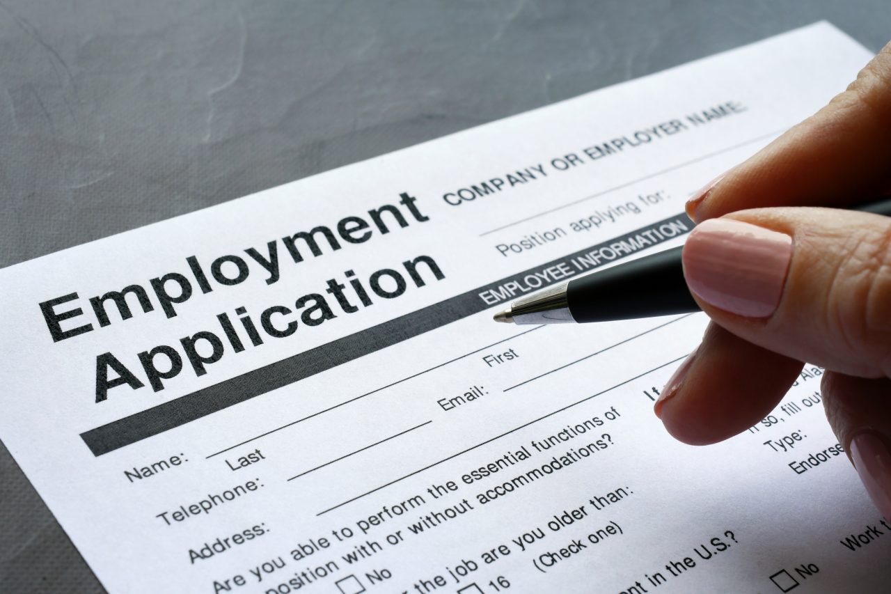 Person filling out employment application