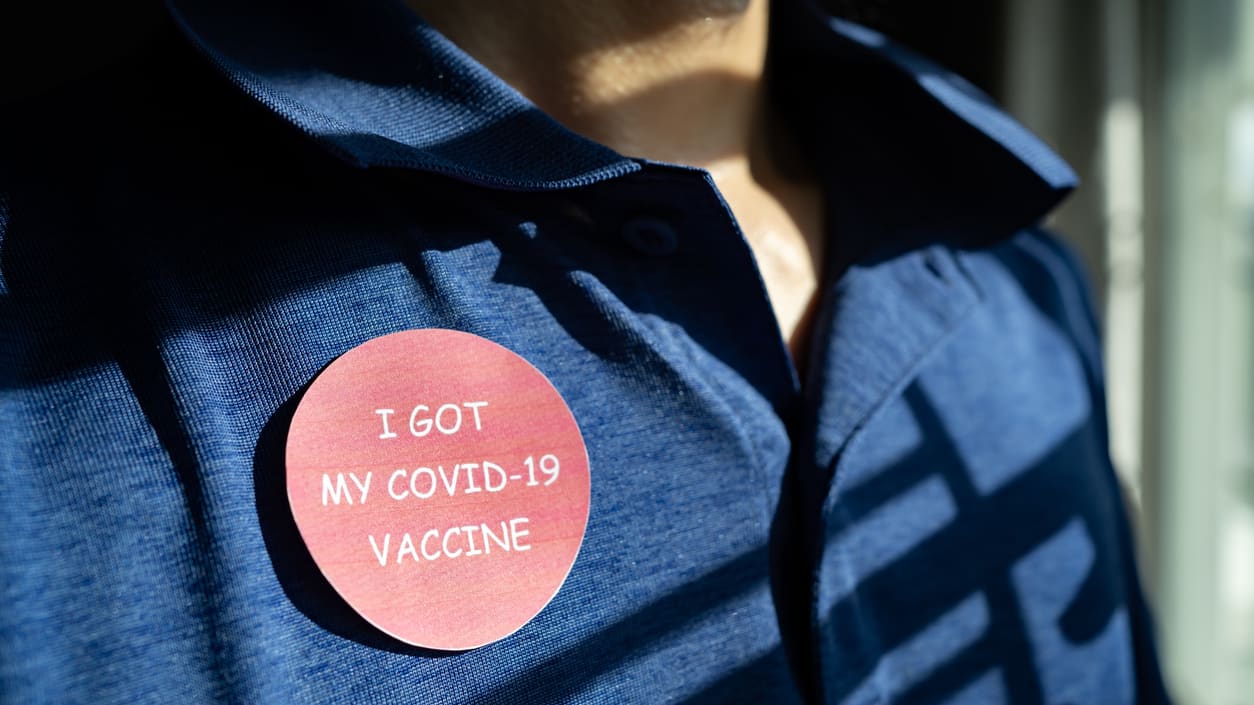 A person wearing a badge that says i got my covid-19 vaccine.