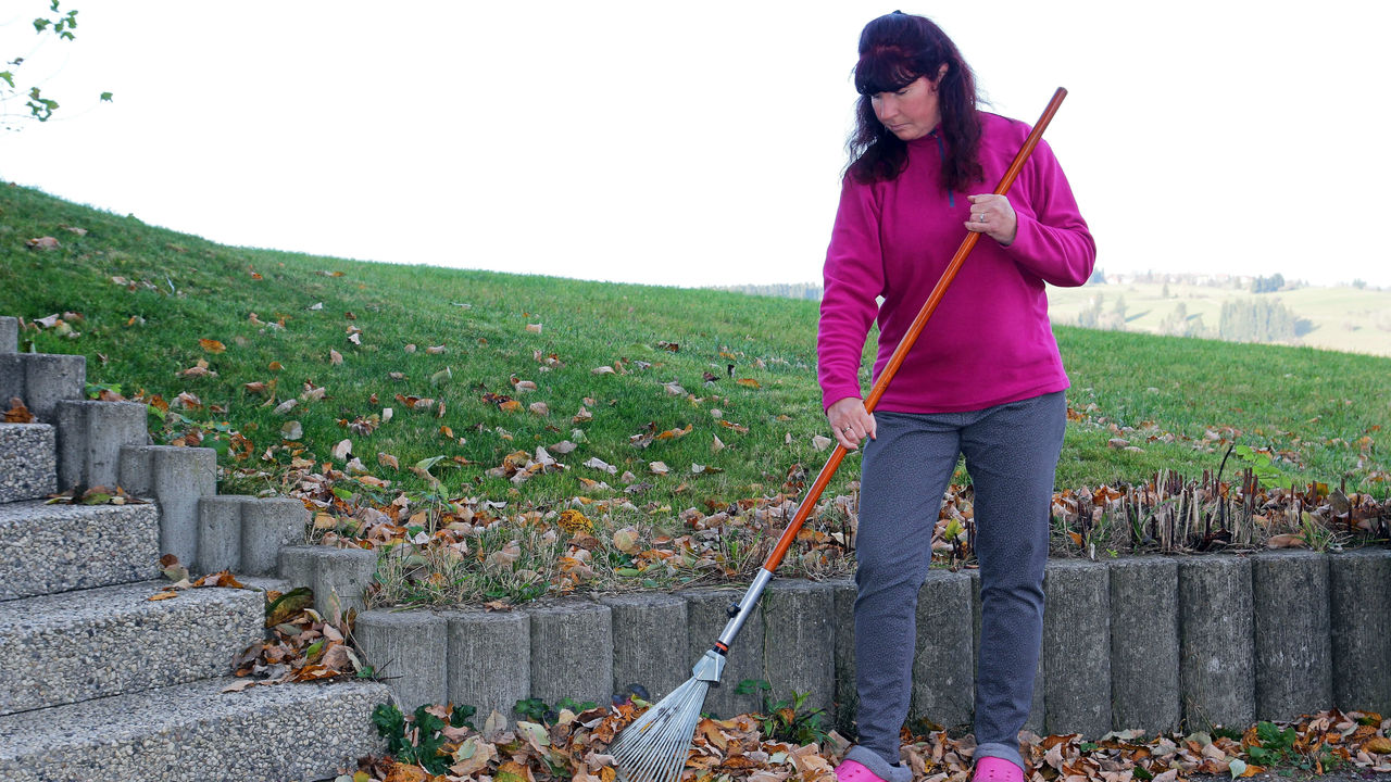 A woman with a broom.