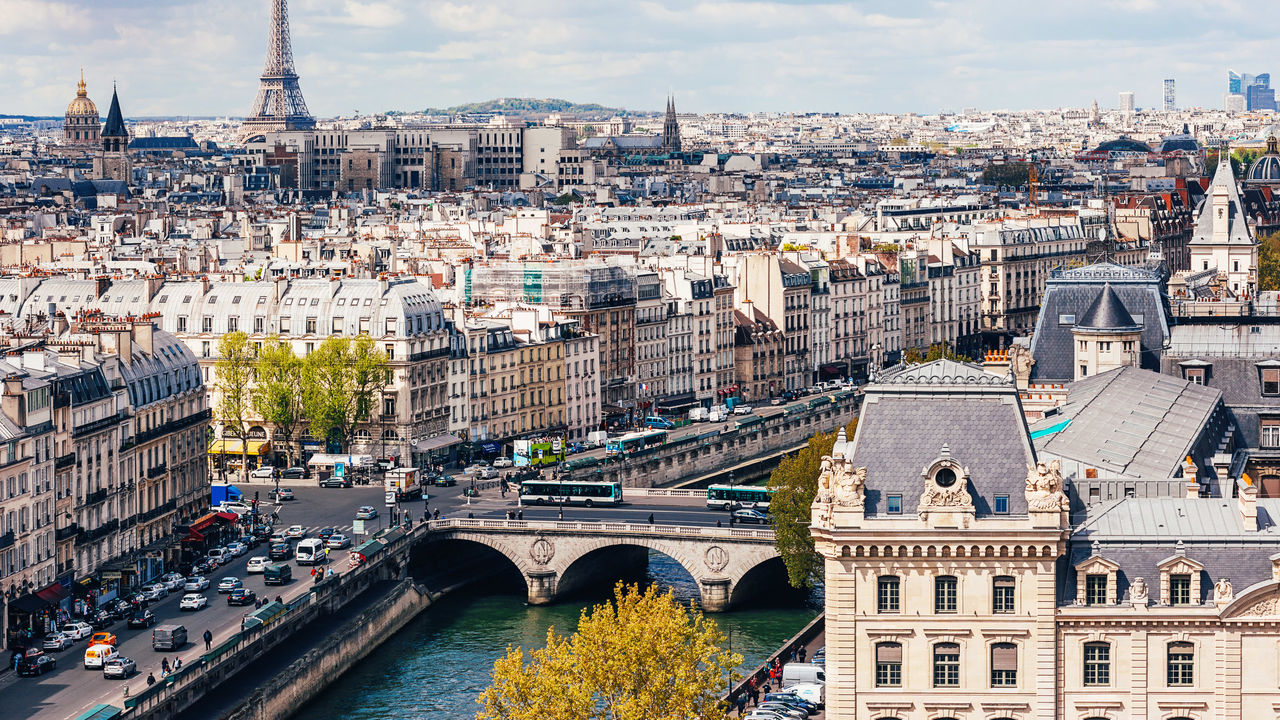 A view of the city of paris with the eiffel tower in the background.