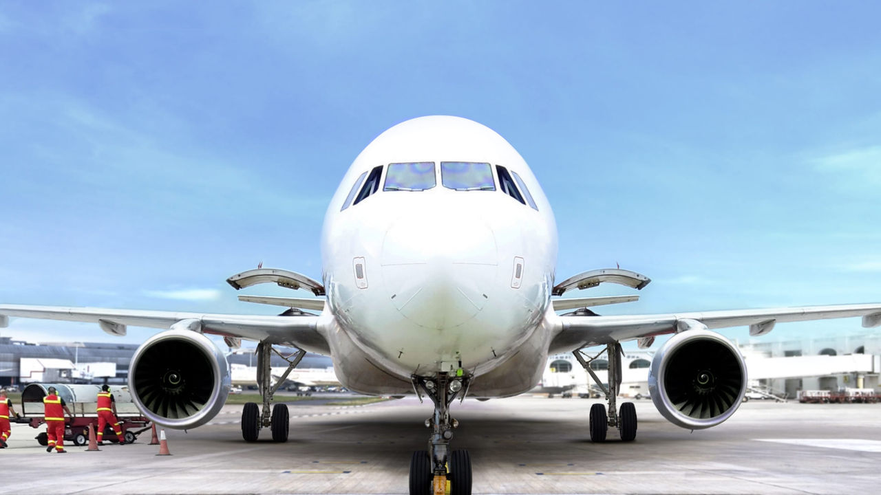 A large airplane sitting on the tarmac.