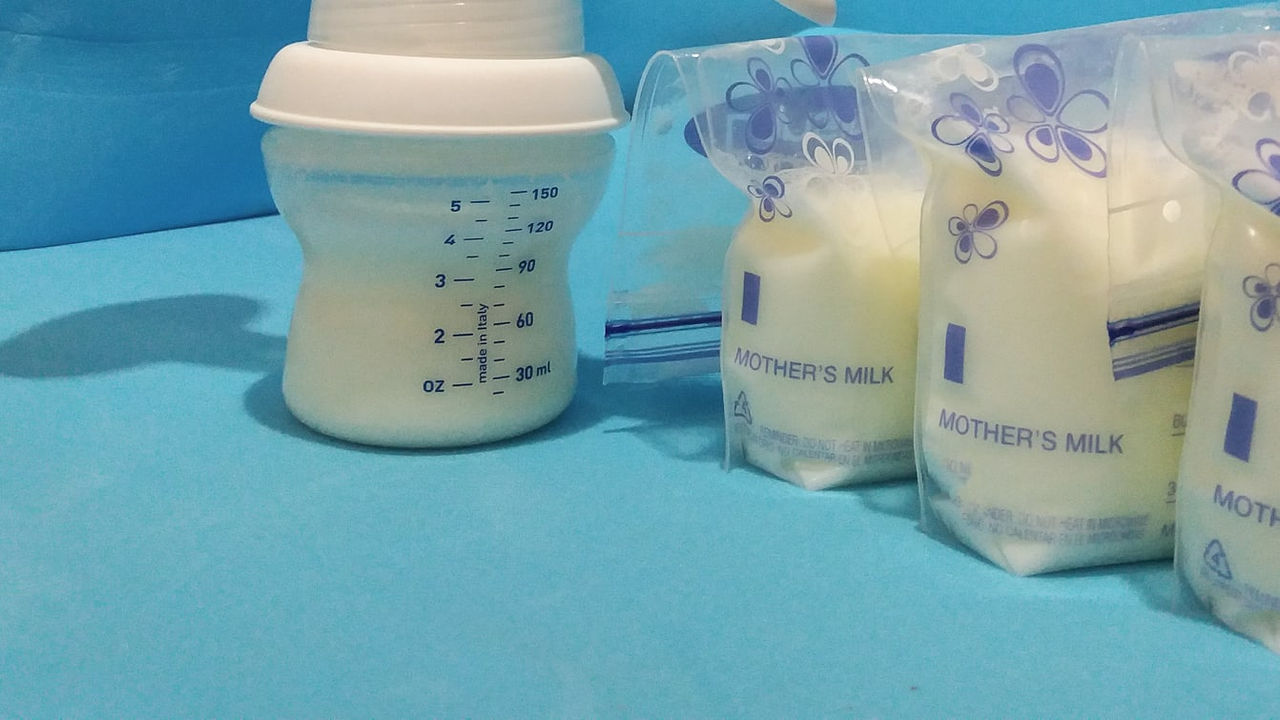 A bottle of milk next to a bottle of milk.
