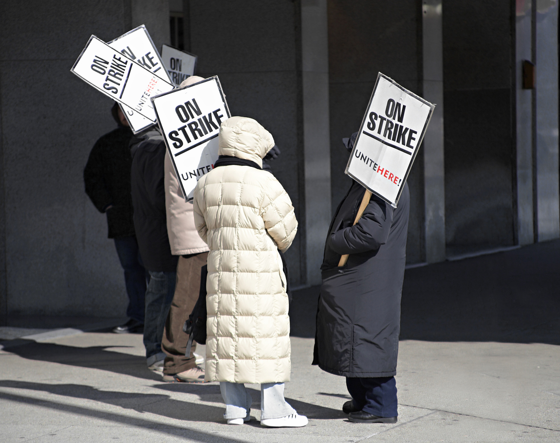 Workers on strike outside a hotel