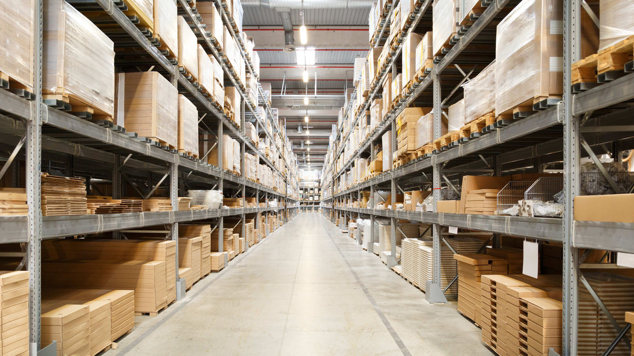 A warehouse filled with boxes and pallets.