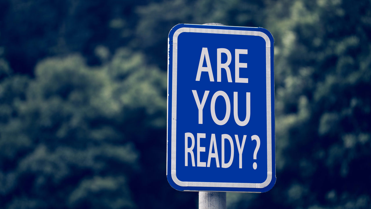 A blue sign that says are you ready?.