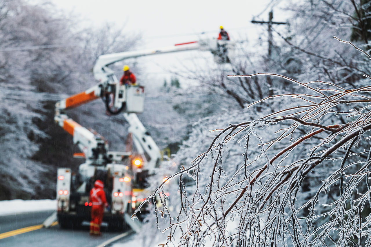 Linesman work to restore power during an intense ice storm.