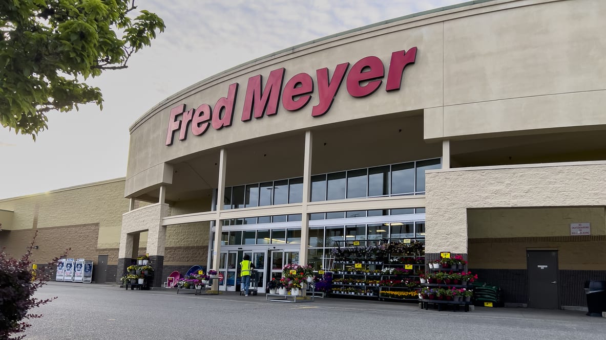 A store with a red meyer sign in front of it.