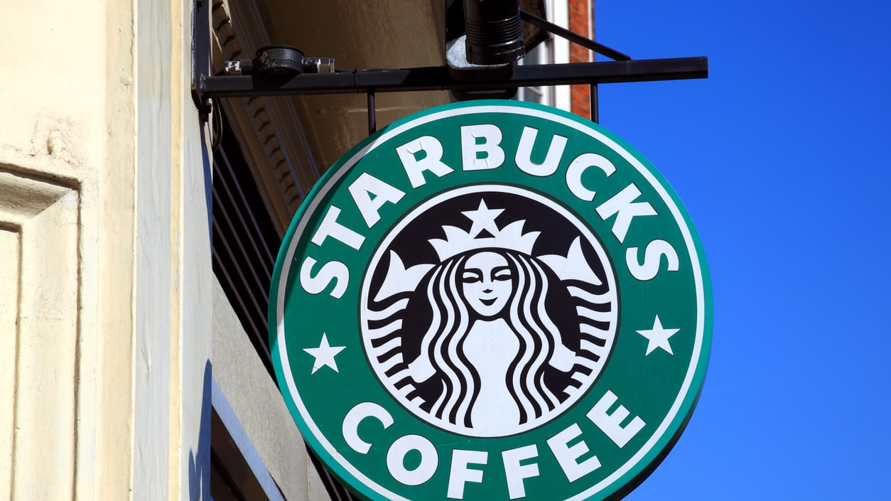 A Starbucks sign with the store logo in the center