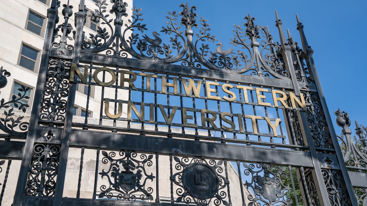 A gate with the word northwestern university on it.