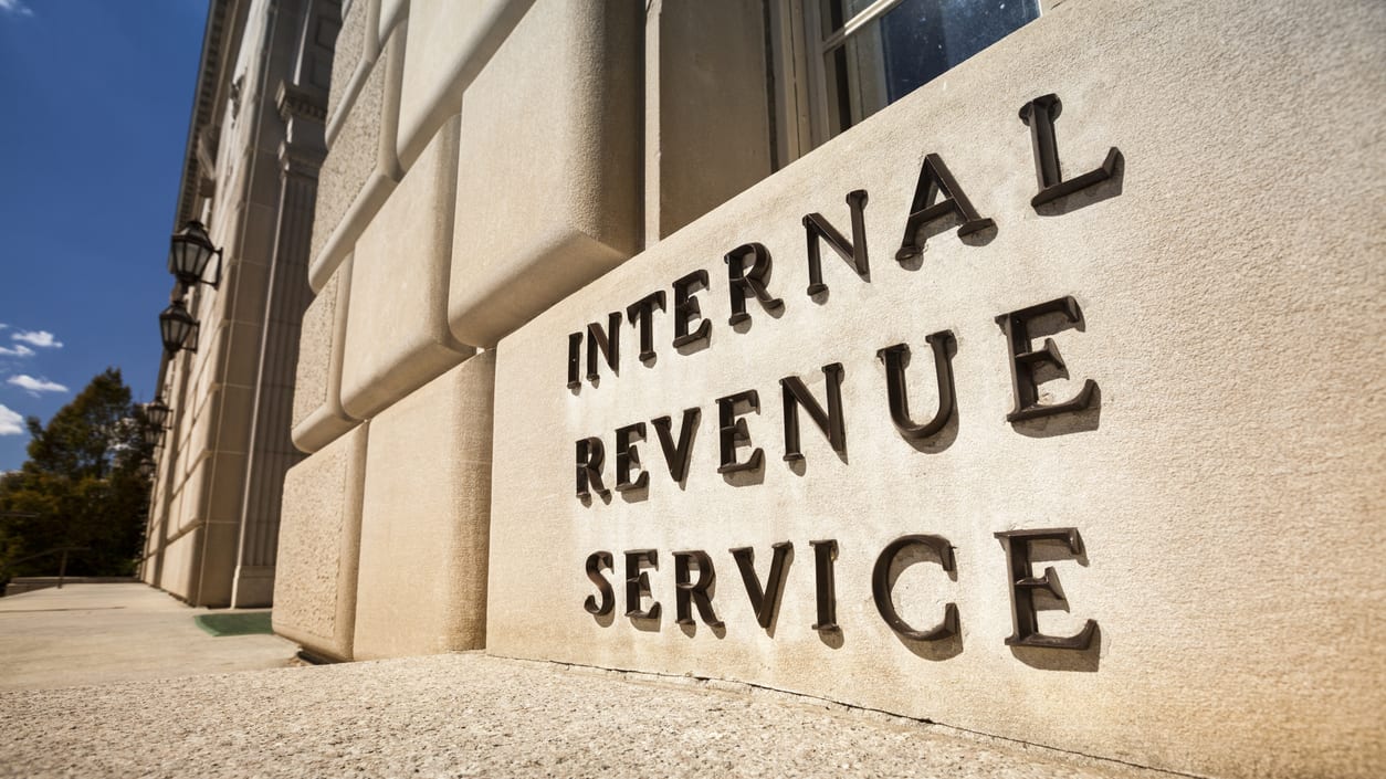 The irs sign is in front of a building.