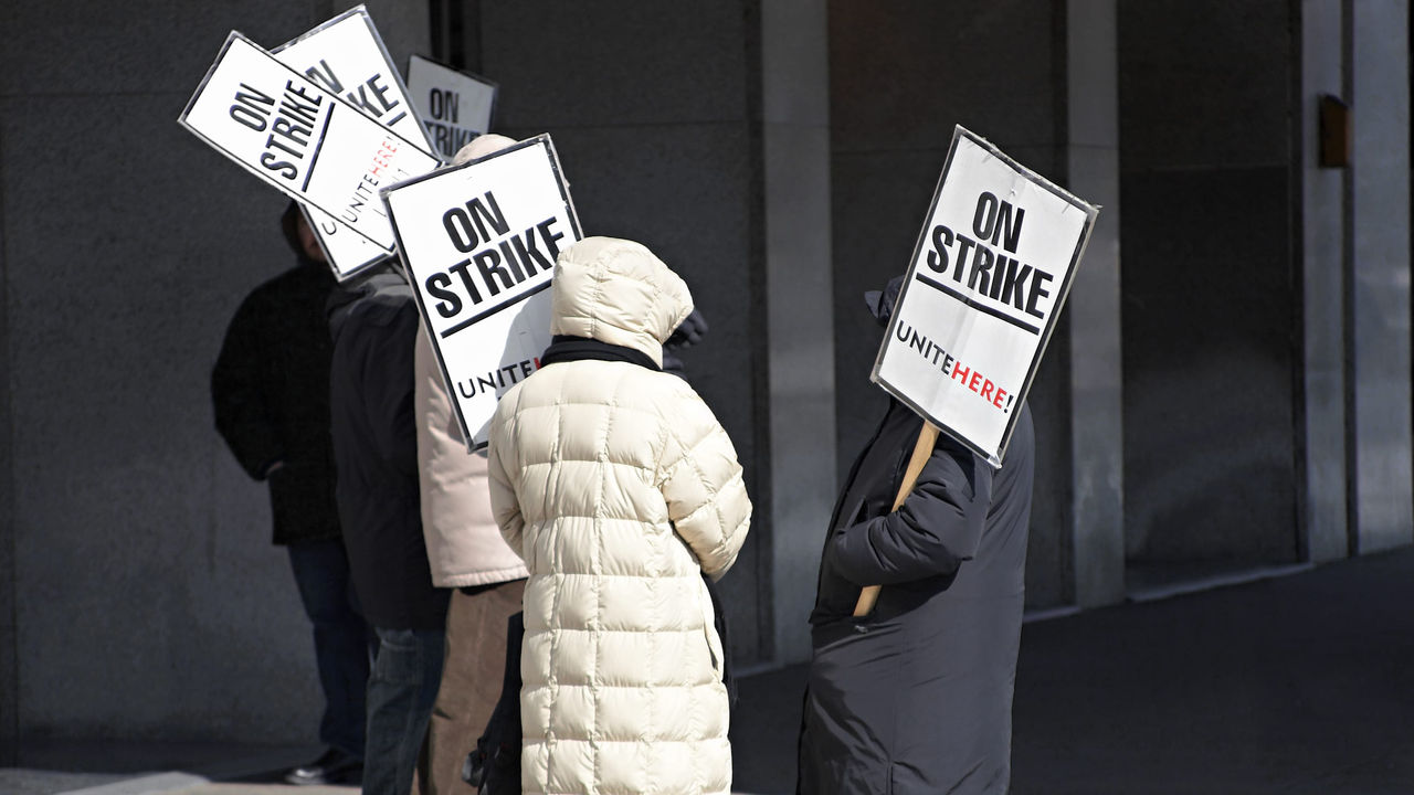 A group of people holding signs.