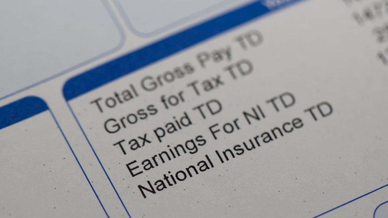 A close up of a tax bill with a total gross pay.