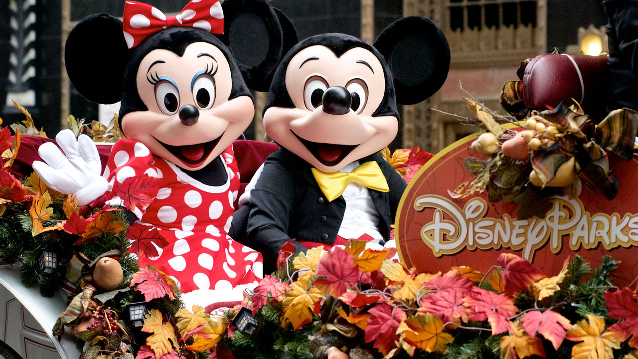 Mickey mouse and minnie mouse in a float.