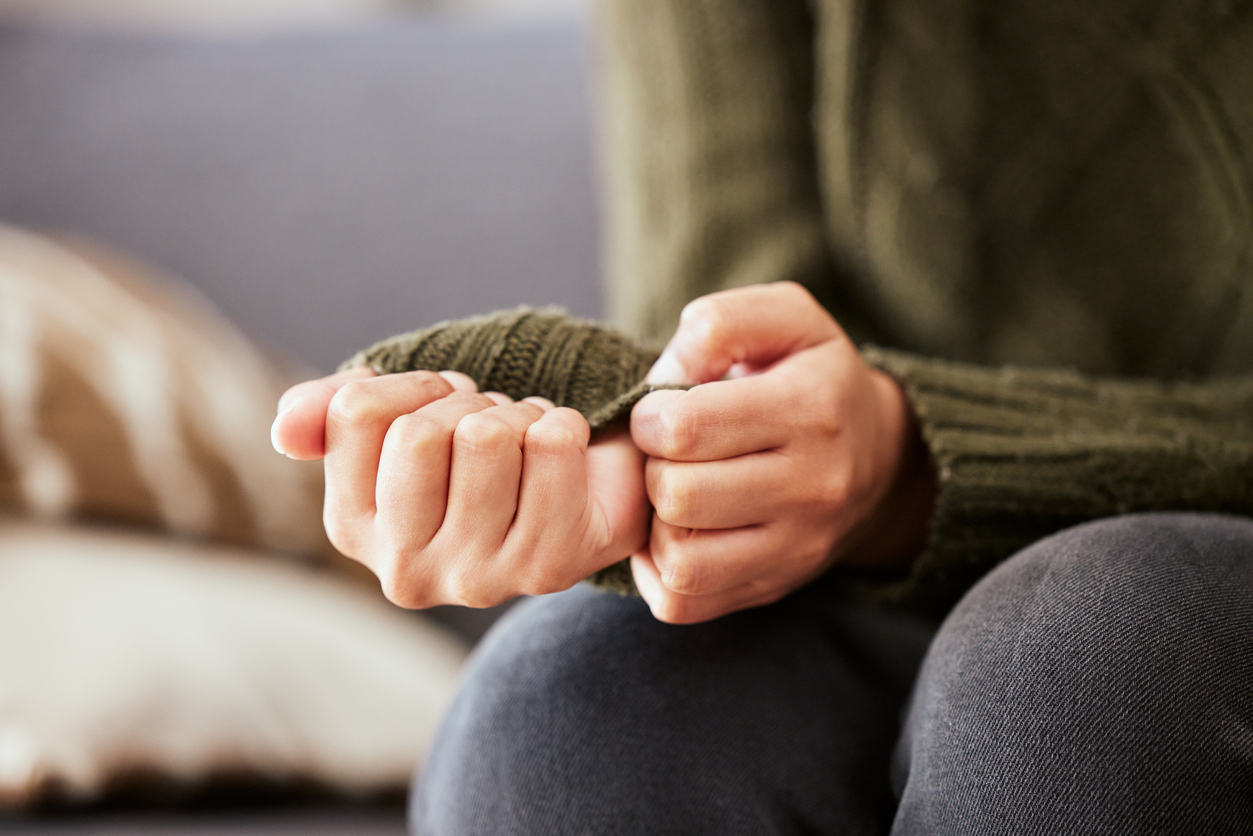 close-up of a person's fidgeting hands, indicating anxiety