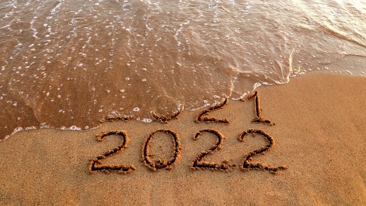 2021 written in the sand on the beach.