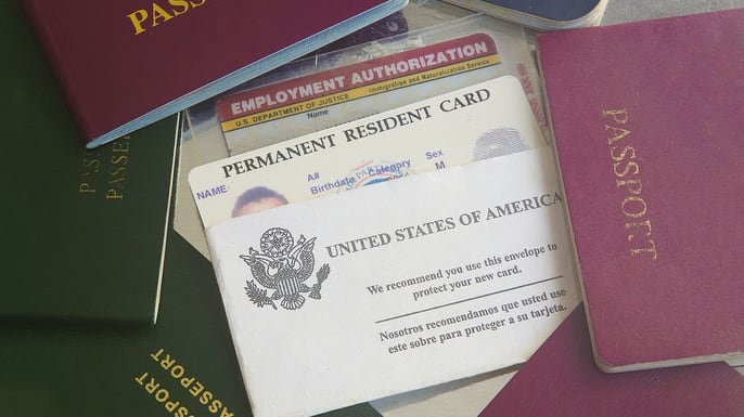 A group of passports on a table.