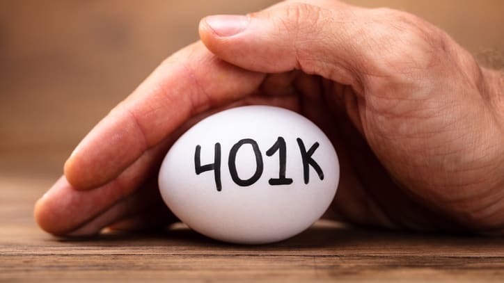 A man's hand holding an egg with the word 40k written on it.