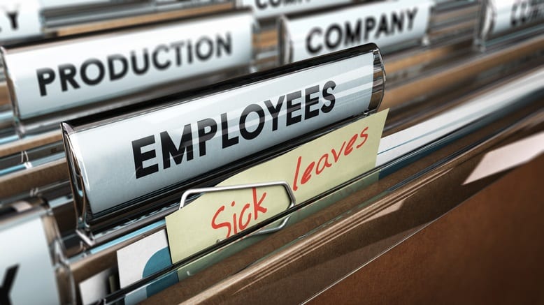 A file folder with a note that says employees sick leave.