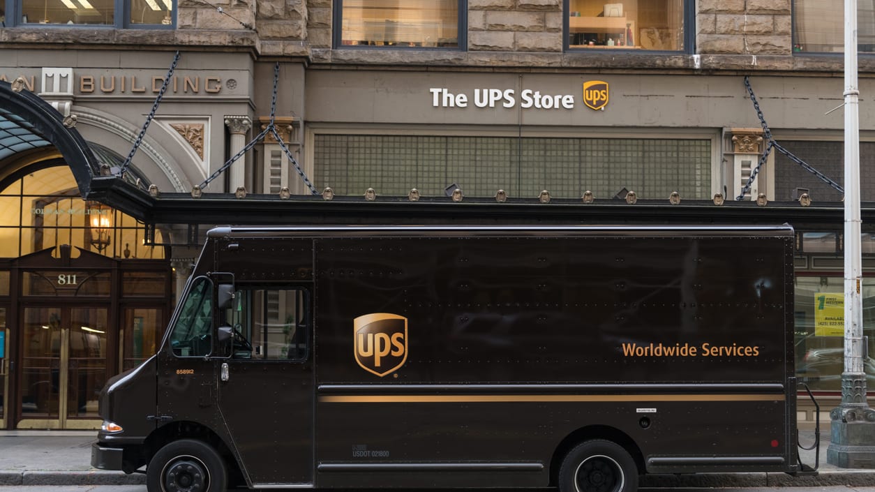 A ups delivery truck parked in front of a building.
