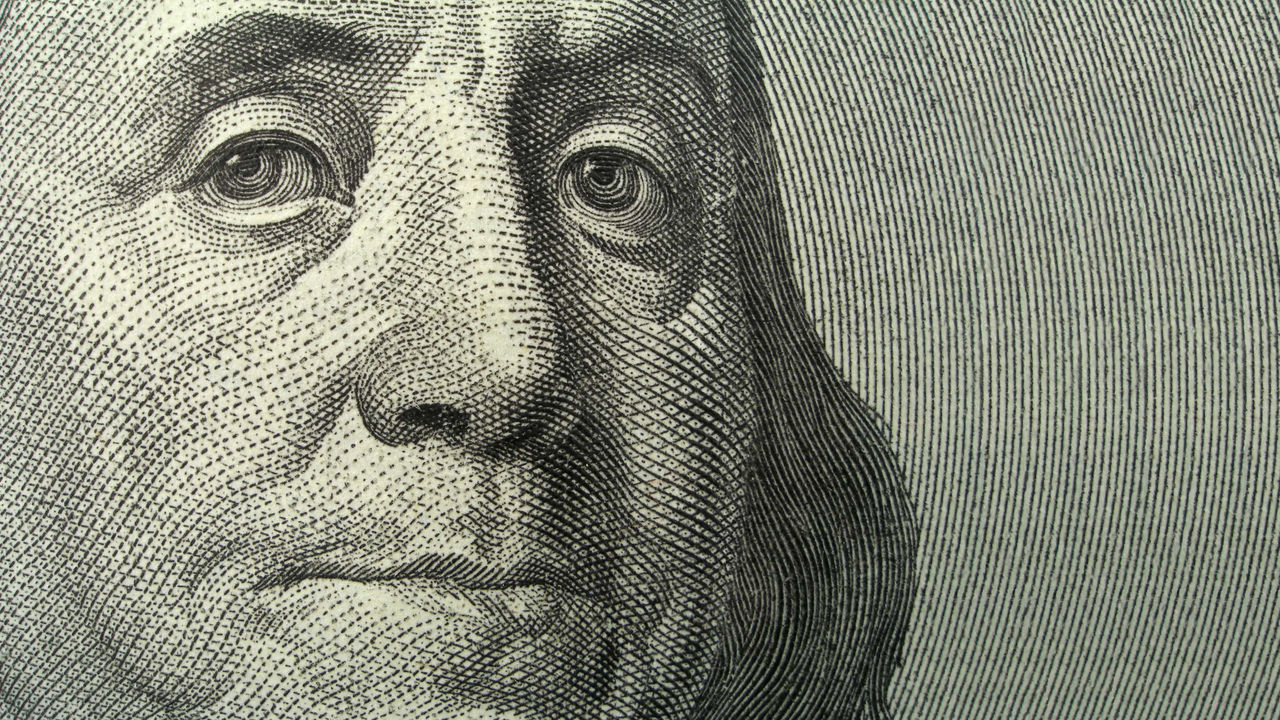 A close up of the face of benjamin franklin.