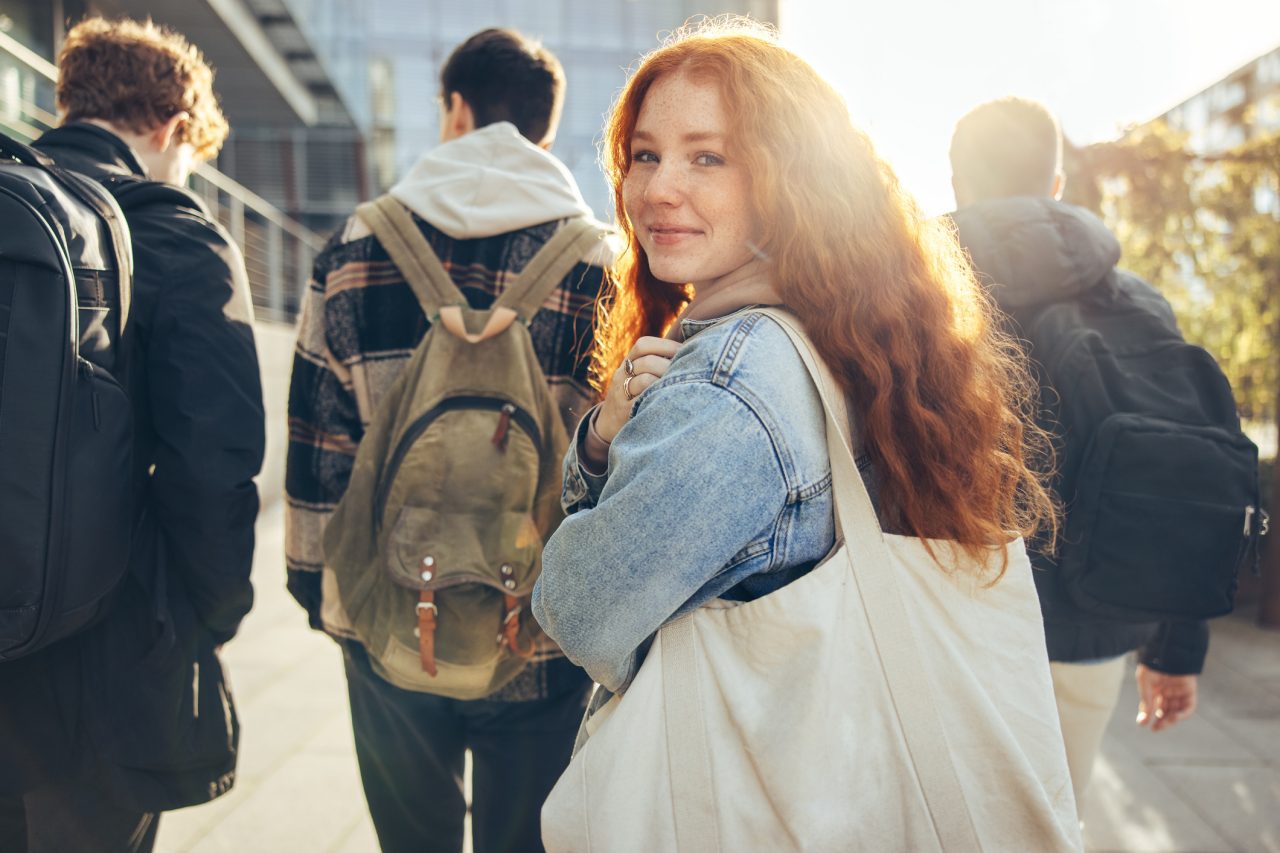 College students travel to their next class period. 
