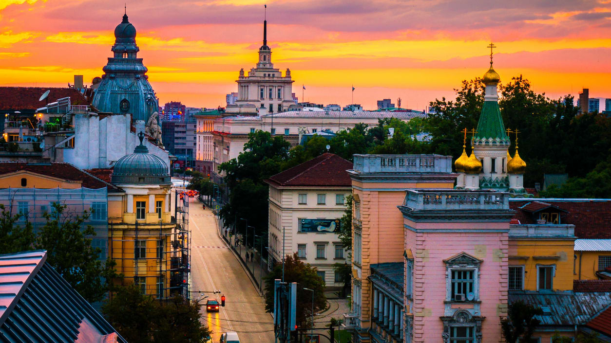 A view of a city at sunset.