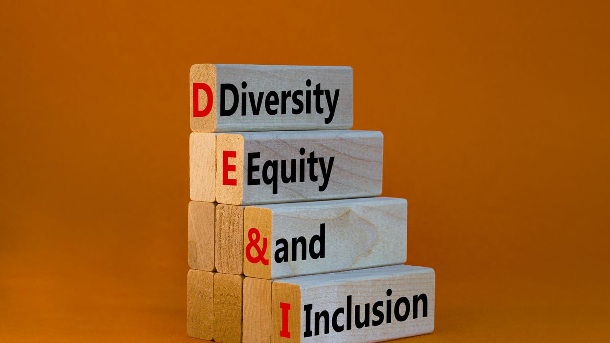 A stack of wooden blocks with the words diversity, equity and inclusion.