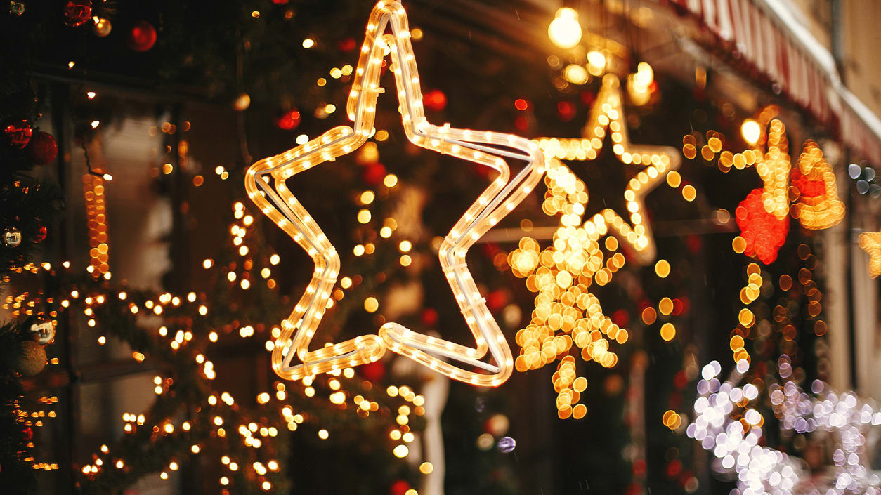 Christmas lights on the side of a store.