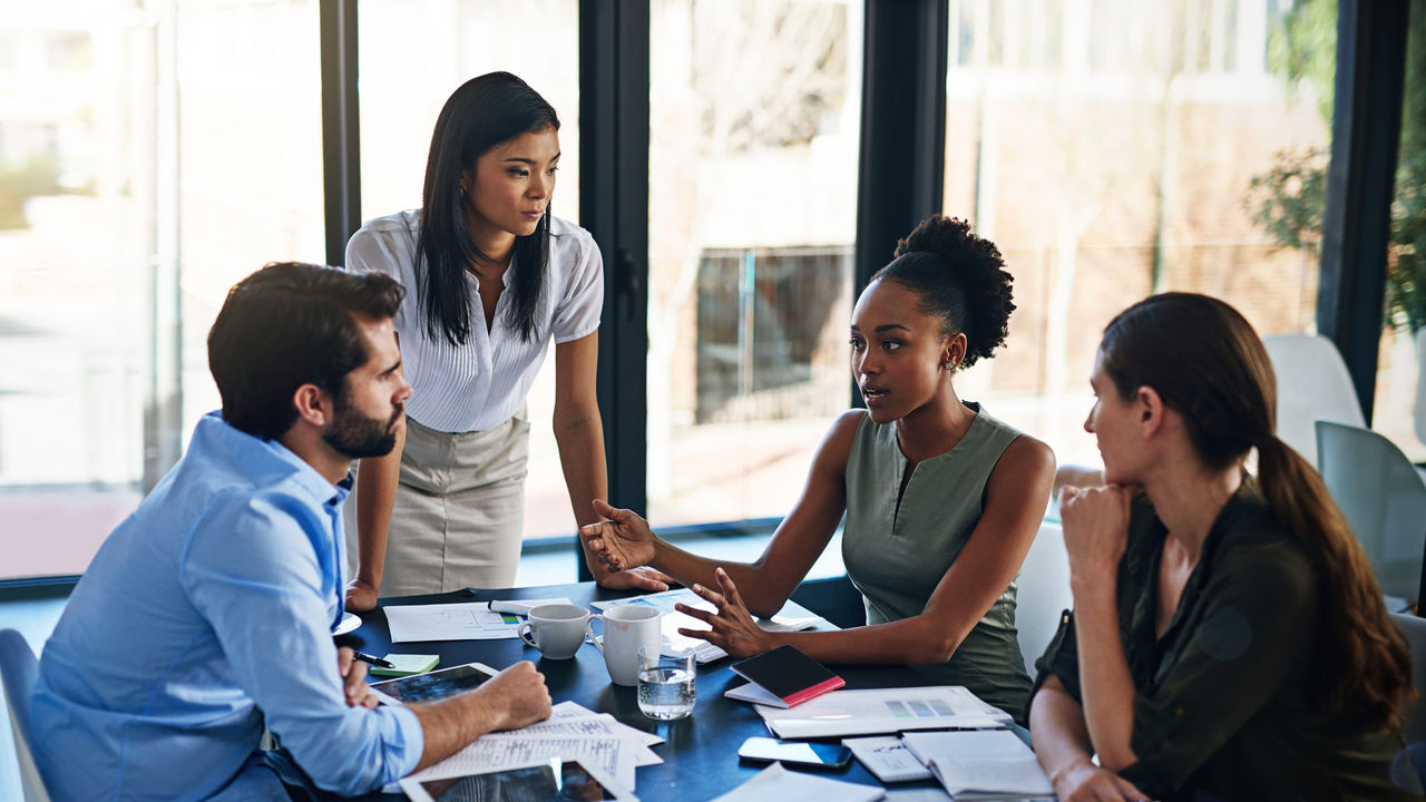 A group of business people having a meeting in a conference room.