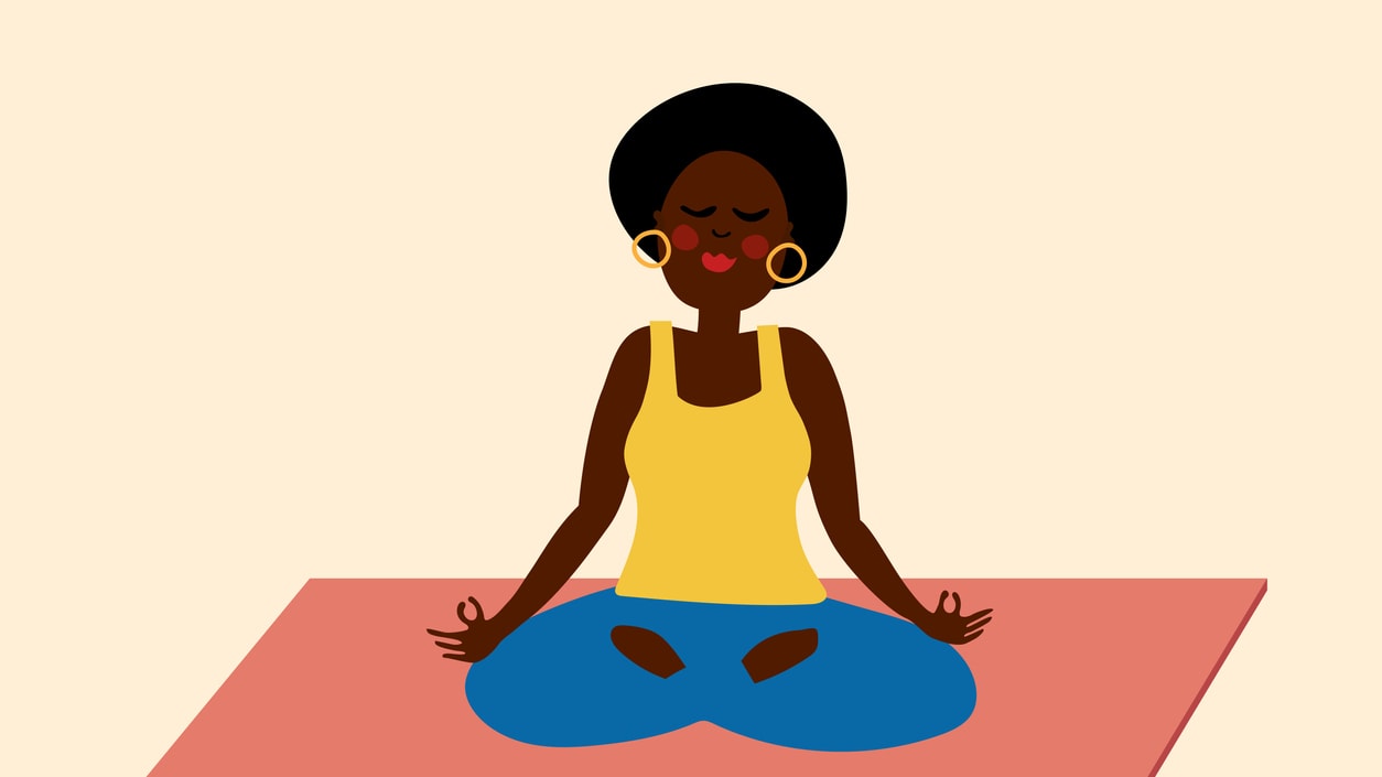 A woman is meditating in a lotus position.