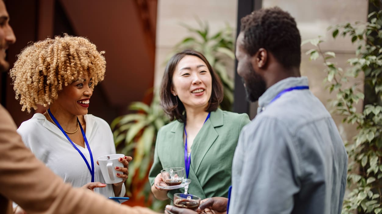 A group of people shaking hands at a business meeting.