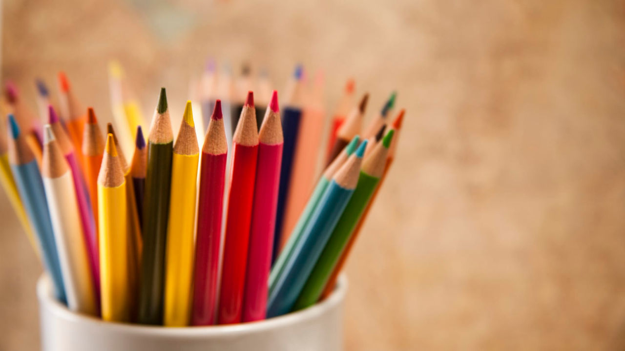 Colorful pencils in a cup.
