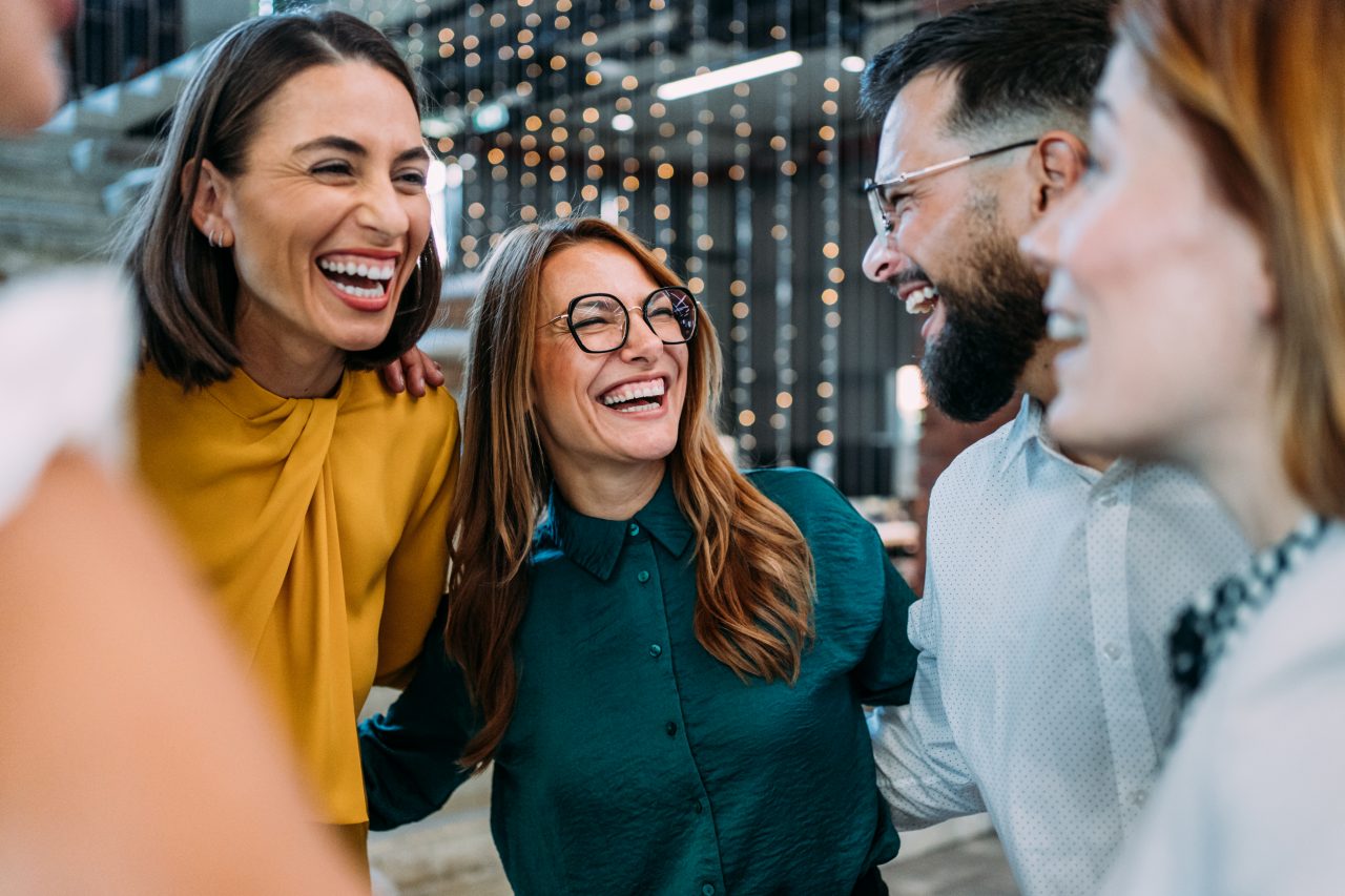 Coworkers laughing and experiencing joy