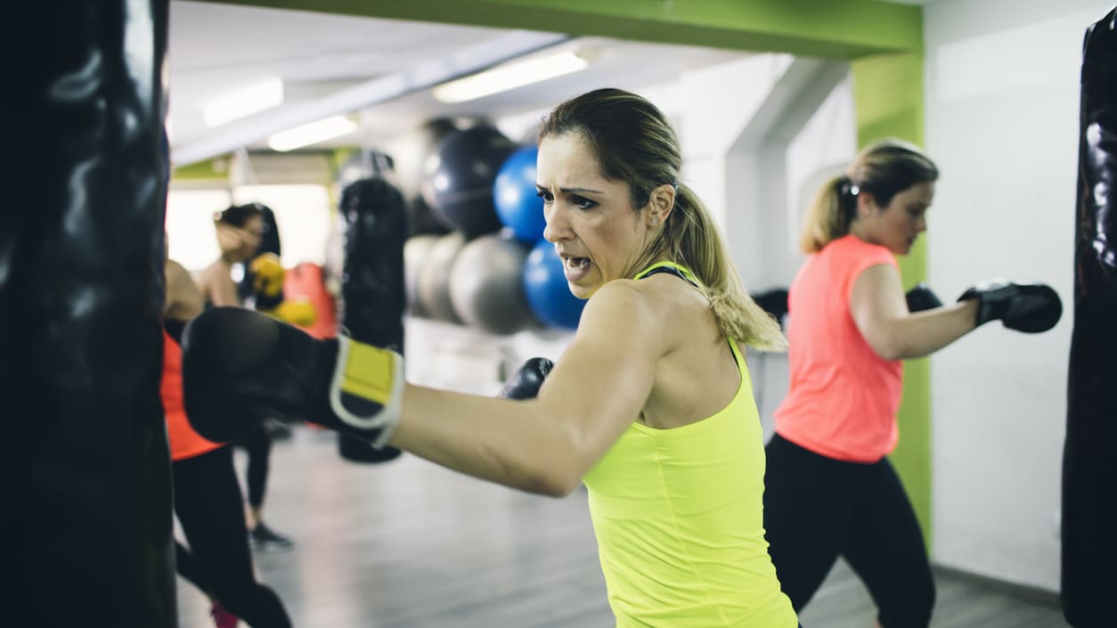 A group of women boxing in a gym.