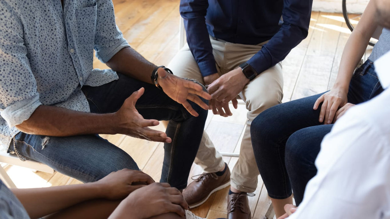 A group of people sitting around a table.