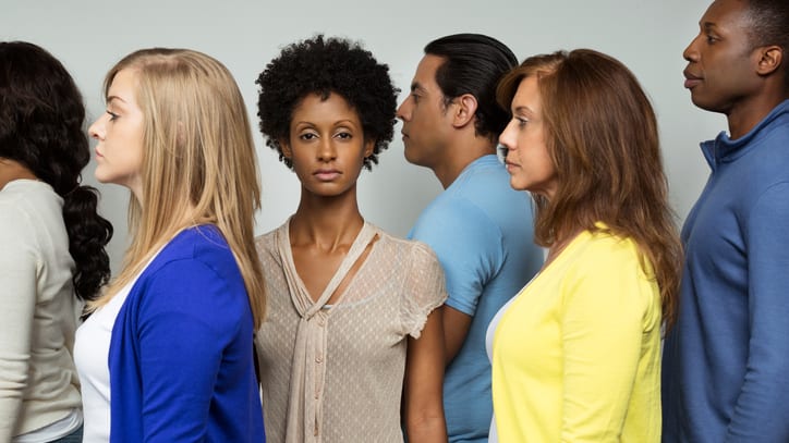 A group of people standing in a line.