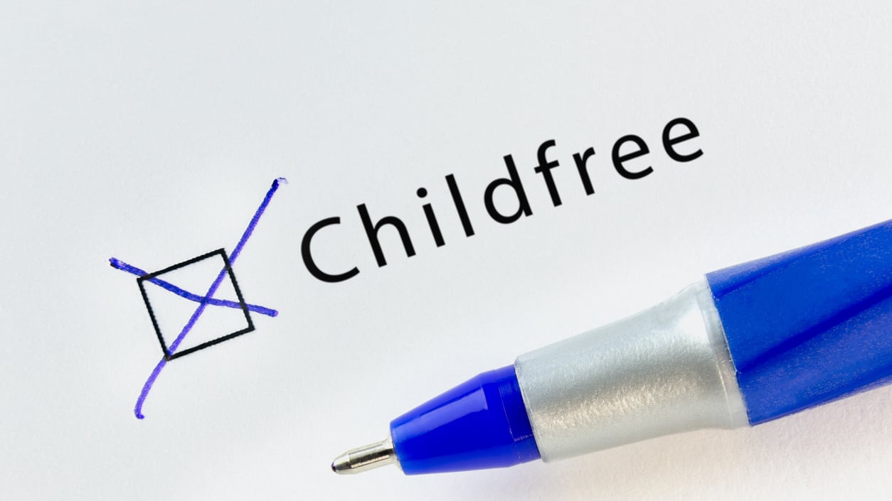 A blue pen with the word childfree written on it.