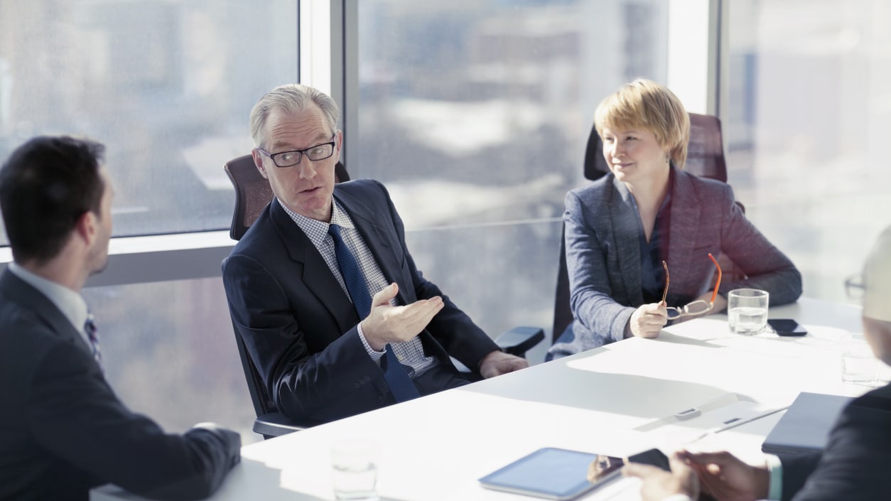 A group of business people having a meeting in a conference room.