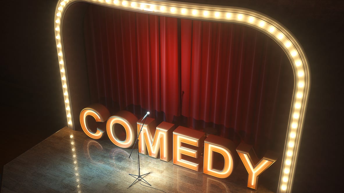 A stage with the word comedy in front of it.